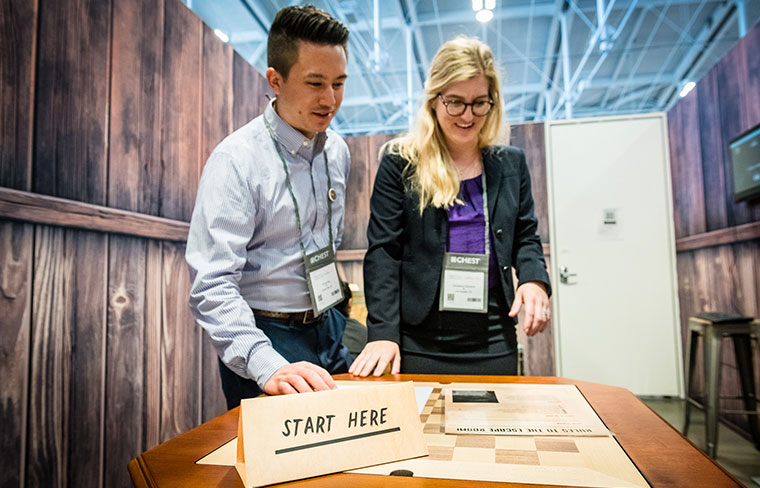 CHEST attendees decipher clues in an escape room on the Exhibit Hall floor at the 2022 Annual Meeting. CHEST 2023 will feature at least two new escape rooms and many other live games, immersive simulations, and interactive educational experiences.